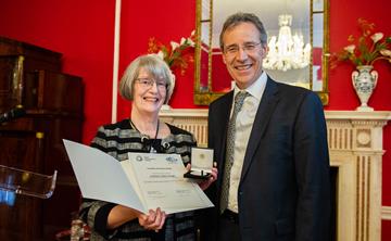 UK ATC Director Gillian Wright reciving the medal at the German Ambassador to the UK’s residence in London .