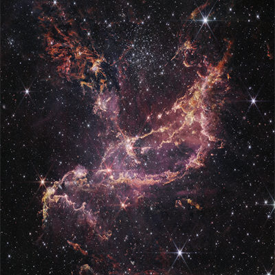 NGC 346, a bright star-forming region in the Small Magellanic Cloud. This image shows a large star field and cosmic dust.